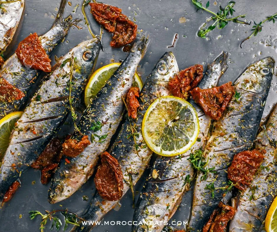 Spicy Moroccan Sardine Sandwich Recipe-Simply Irresistible 5 Assembly of a Moroccan sardine sandwich with traditional ingredients on a rustic table – MoroccanEats
