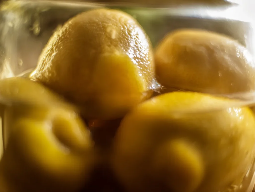 Moroccan Beldi Preserved Lemons: Ultimate Tangy Delight 3 u1416823846 A close up artistic shot of several glistening go ebd6c9d8 bf21 43e9 ab6b c73c91dd4937 0 www.moroccaneats.com
